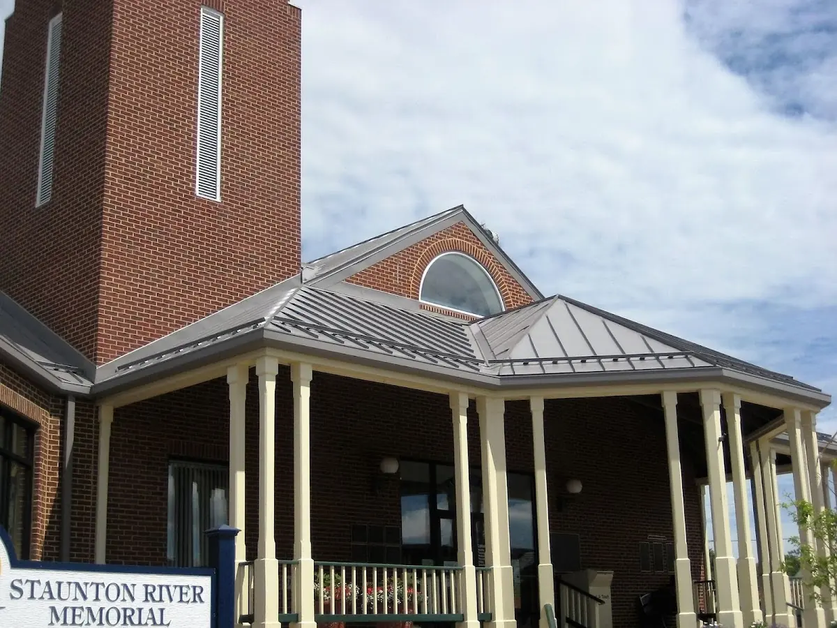 Skilled roofing craftsmen working on a residential roof in Highland